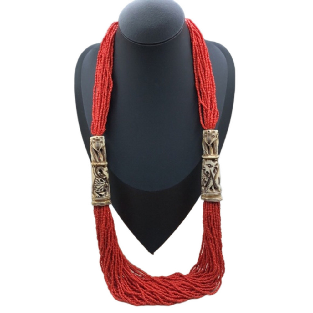 Artisan statement beaded carved elephant necklace boho tribal festival vibrant.